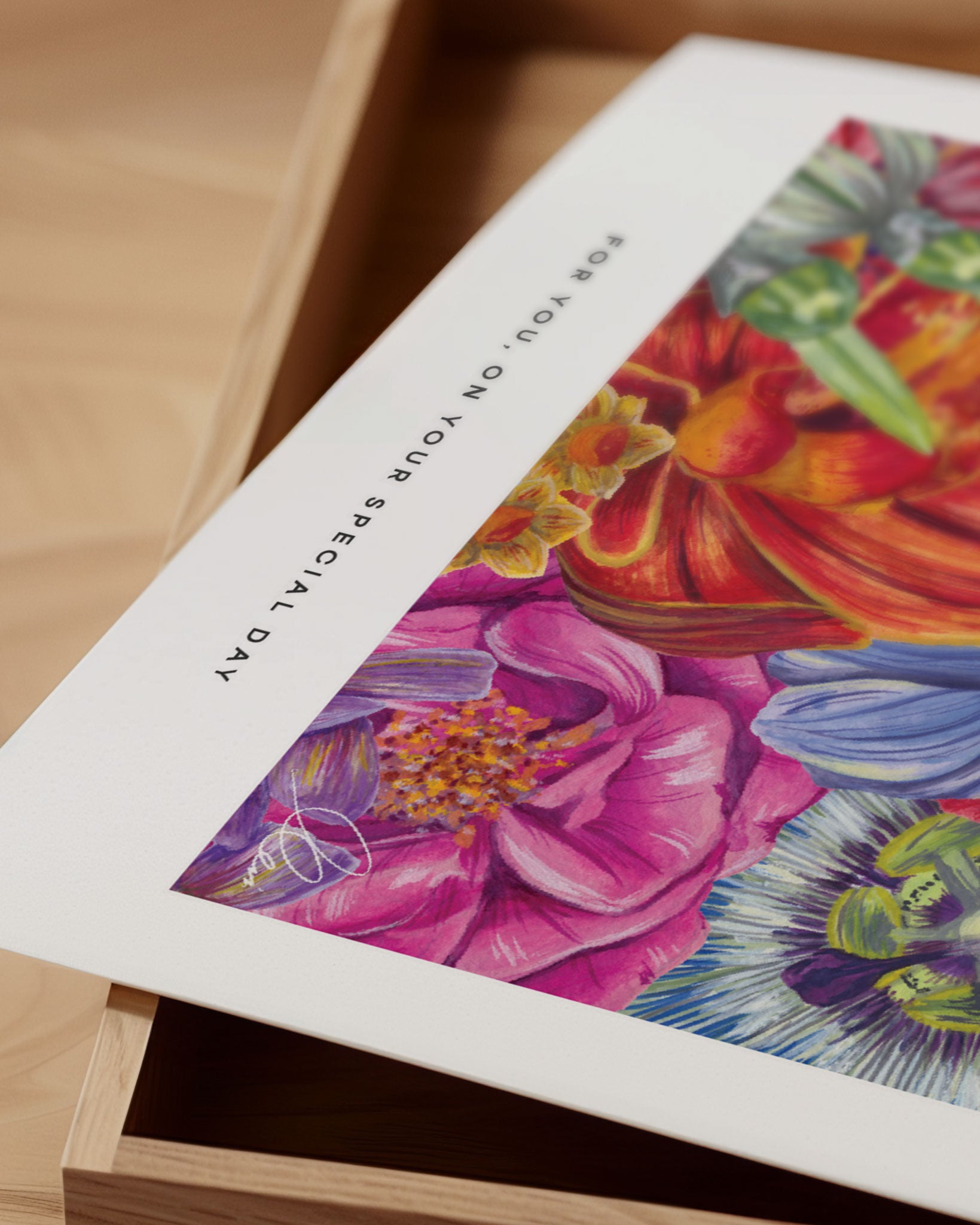 Close up of floral poster print on wooden background