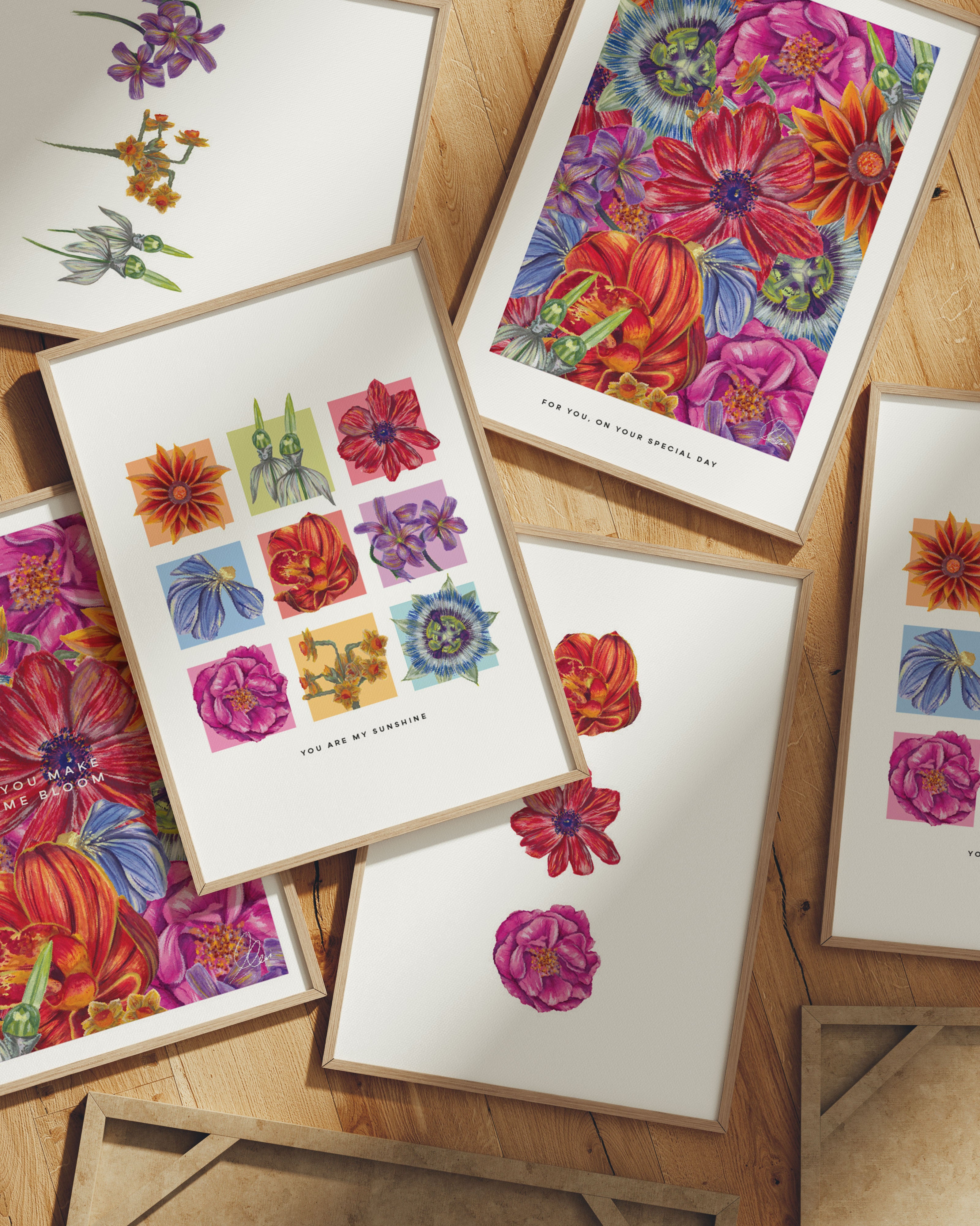Colorful floral prints on a wooden surface