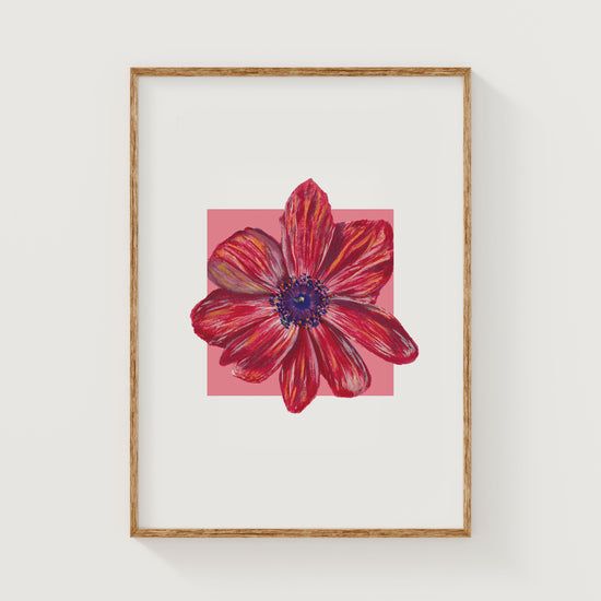 Framed artwork of a red and blue flower on a white background