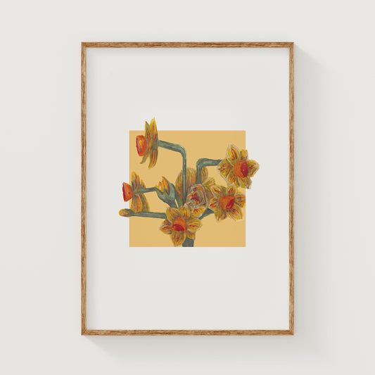 Framed artwork of a yellow daffodil floral design on a yellow square background